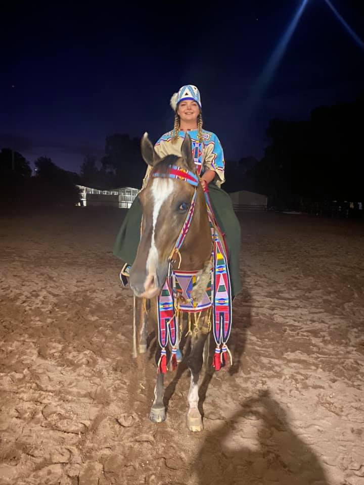 A person riding a camel in the desert

Description automatically generated with medium confidence